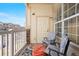 Cozy balcony with seating and view at 5735 N Genoa Way # 11-205, Aurora, CO 80019