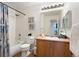 Clean bathroom with tub and shower, modern vanity, and decor at 5735 N Genoa Way # 11-205, Aurora, CO 80019
