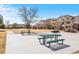 Well-maintained community area with picnic tables and a grassy area at 5735 N Genoa Way # 11-205, Aurora, CO 80019