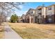 Attractive exterior view of the condos with well-kept landscaping at 5735 N Genoa Way # 11-205, Aurora, CO 80019