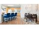 Bright kitchen featuring a modern design, with a dining area, wooden cabinets, and natural light at 5735 N Genoa Way # 11-205, Aurora, CO 80019