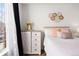 Bright main bedroom with a ceiling fan, neutral decor and a large window at 5735 N Genoa Way # 11-205, Aurora, CO 80019