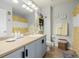 Charming bathroom with stylish blue vanity, bee-themed decor, and tiled flooring at 9047 Apache Plume Dr # D, Parker, CO 80134