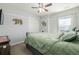 Comfortable bedroom features wall art, natural light, and closet space at 9047 Apache Plume Dr # D, Parker, CO 80134