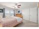 Cozy bedroom with a ceiling fan, closet, and a window with neighborhood views at 9047 Apache Plume Dr # D, Parker, CO 80134