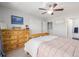 Light-filled bedroom features a wooden bed, closet, and an adjacent bathroom at 9047 Apache Plume Dr # D, Parker, CO 80134