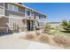 Inviting townhome exterior showcasing a charming entryway, manicured landscaping, and a well-lit walkway at 9047 Apache Plume Dr # D, Parker, CO 80134
