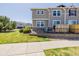 Well-maintained townhome with neat landscaping and a small gated back patio area at 9047 Apache Plume Dr # D, Parker, CO 80134