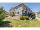 Well-maintained townhome featuring neutral siding, stone accents and a professionally landscaped yard at 9047 Apache Plume Dr # D, Parker, CO 80134