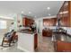 Modern kitchen featuring stainless steel appliances, dark cabinetry, and an open layout at 9047 Apache Plume Dr # D, Parker, CO 80134