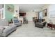 Open-concept living space offering neutral paint, plenty of natural light, and updated flooring at 9047 Apache Plume Dr # D, Parker, CO 80134