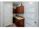 Well-organized pantry offers generous storage space with wood cabinetry and countertops at 9047 Apache Plume Dr # D, Parker, CO 80134