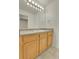 Bathroom with a single vanity, lots of light, and a large mirror at 1311 S Kingston St, Aurora, CO 80012