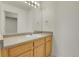 Bathroom with a single vanity, lots of light, and a large mirror at 1311 S Kingston St, Aurora, CO 80012