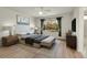 Staged bedroom with hardwood floors, ceiling fan and a big window at 1311 S Kingston St, Aurora, CO 80012