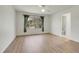 Big and spacious bedroom featuring hardwood floors and a large window at 1311 S Kingston St, Aurora, CO 80012