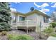 Exterior side view with small deck, showcasing the architectural details and outdoor space of the home at 1311 S Kingston St, Aurora, CO 80012