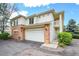 Inviting two-story home with a two-car garage and brick accents, perfect for comfortable living at 1311 S Kingston St, Aurora, CO 80012