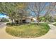 Well-kept two-story house featuring an attached two-car garage, green lawn, and mature trees at 1311 S Kingston St, Aurora, CO 80012