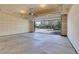 Open two-car garage with overhead door, offering easy access and parking with natural light streaming in at 1311 S Kingston St, Aurora, CO 80012