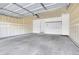 Clean two-car garage ready for use, featuring a bright interior, overhead door, and ample space at 1311 S Kingston St, Aurora, CO 80012