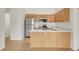 Well-lit kitchen with modern appliances and wood cabinets and plenty of storage at 1311 S Kingston St, Aurora, CO 80012