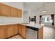 Kitchen with wood cabinets, stone countertops and stainless steel appliances at 1311 S Kingston St, Aurora, CO 80012