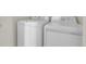 Close-up of a white, front loading washer and dryer at 1311 S Kingston St, Aurora, CO 80012