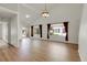 Bright open-concept living space with hardwood floors and large windows at 1311 S Kingston St, Aurora, CO 80012