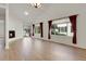 Spacious living area with fireplace, hardwood floors, large windows, and natural light at 1311 S Kingston St, Aurora, CO 80012