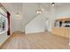 Bright living room with high ceilings, wood floors, and large windows allowing natural light at 1311 S Kingston St, Aurora, CO 80012