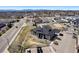 Bird's eye view features the apartment building near a local thoroughfare with commercial properties and residential zones at 875 E 78Th Ave # 70, Denver, CO 80229
