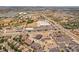 An aerial view showcases the surrounding area of an apartment building, including commercial zones and city views at 875 E 78Th Ave # 70, Denver, CO 80229