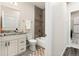 Bathroom with modern vanity, granite countertop, and tiled shower-over-tub at 875 E 78Th Ave # 70, Denver, CO 80229