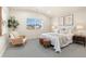 Bright bedroom features large window, neutral colors, soft decor and carpeted floors at 875 E 78Th Ave # 70, Denver, CO 80229