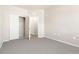 Bedroom with closet featuring neutral paint and carpeting at 875 E 78Th Ave # 70, Denver, CO 80229
