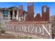 Entrance sign displaying 'City Horizon' and the address number, set against a backdrop of metal art at 875 E 78Th Ave # 70, Denver, CO 80229