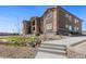 Stylish multi-Gathering home featuring stone details, balconies, and well-maintained landscaping at 875 E 78Th Ave # 70, Denver, CO 80229