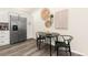 Well-lit dining area features a modern table with seating and stylish decor adjacent to kitchen at 875 E 78Th Ave # 70, Denver, CO 80229