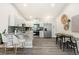 Bright kitchen with stainless steel appliances, marble countertops, and adjacent breakfast nook at 875 E 78Th Ave # 70, Denver, CO 80229