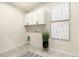Laundry room with decor and washer/dryer hookups and tiled flooring at 875 E 78Th Ave # 70, Denver, CO 80229