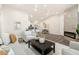 Bright living room featuring modern decor, a fireplace, and an open layout to the kitchen at 875 E 78Th Ave # 70, Denver, CO 80229