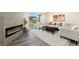 Inviting living room with a fireplace, balcony access, and stylish furnishings at 875 E 78Th Ave # 70, Denver, CO 80229