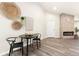 Living room with neutral colors featuring fireplace, front door, and hardwood style flooring at 875 E 78Th Ave # 70, Denver, CO 80229