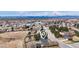 An aerial shot of a property showcasing its location in a neighborhood near a town with mountain views at 6680 E Rustic Dr, Parker, CO 80138