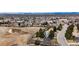 A beautiful aerial view showcases a property's proximity to the highway, town, and green field at 6680 E Rustic Dr, Parker, CO 80138