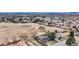 A stunning aerial view of a neighborhood property next to a field with easy access to the city at 6680 E Rustic Dr, Parker, CO 80138