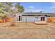 A spacious backyard with a small deck and sliding glass doors, offering a private outdoor space at 6680 E Rustic Dr, Parker, CO 80138