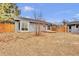 Backyard features a wood fence, and a grassy area at 6680 E Rustic Dr, Parker, CO 80138