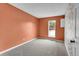 Comfortable bedroom featuring plush carpet, a window, and an open closet at 6680 E Rustic Dr, Parker, CO 80138